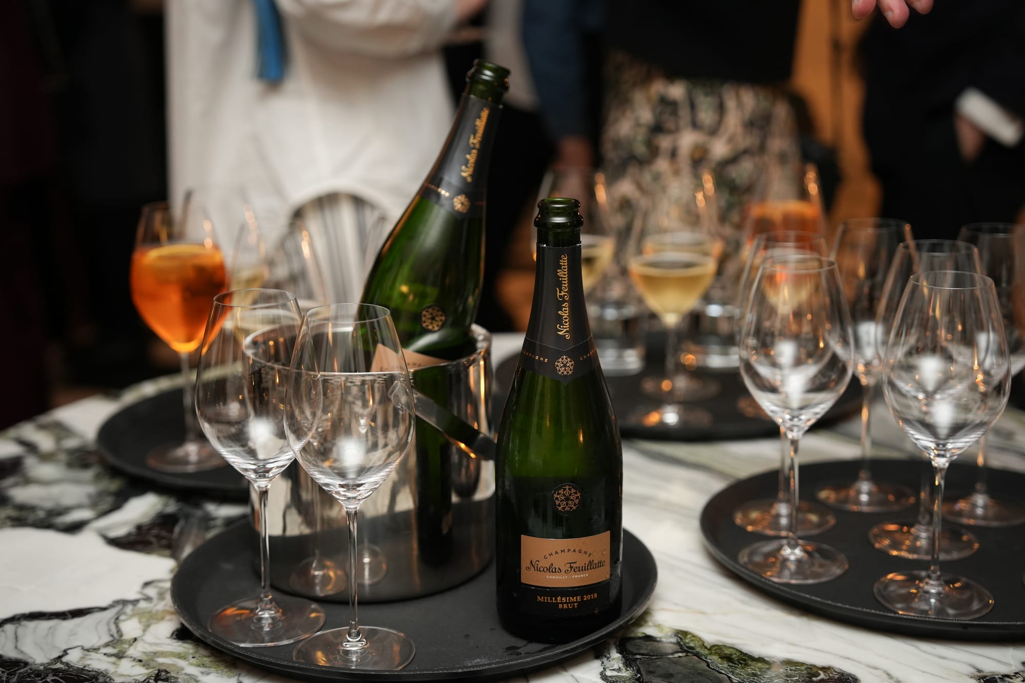 Champagne and glassware prepared for a conference reception at No. 30 Knightsbridge