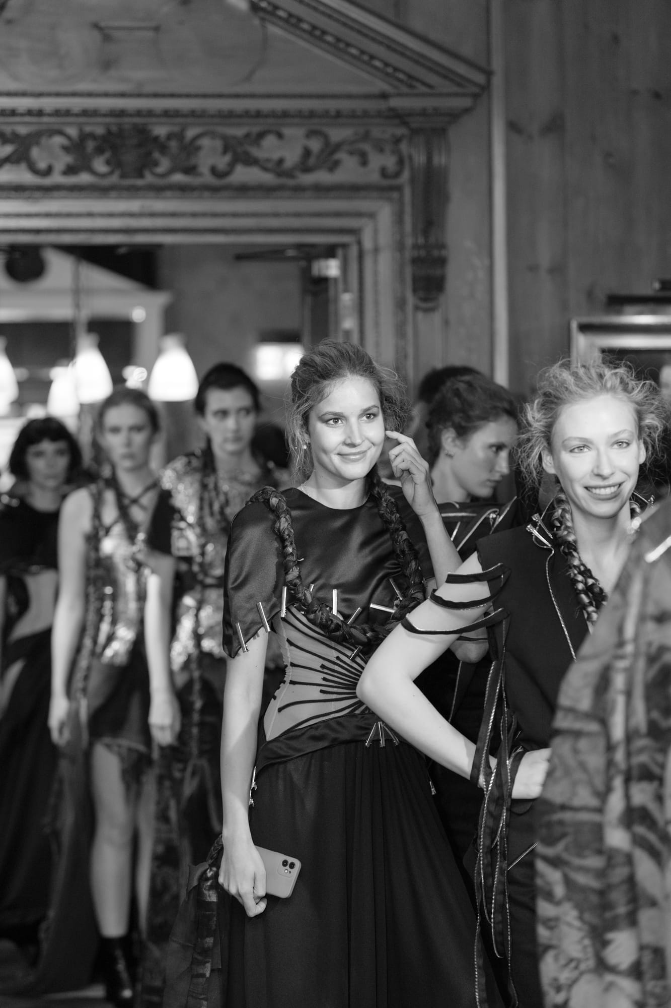Models preparing to enter a fashion showcase at No. 30 Knightsbridge